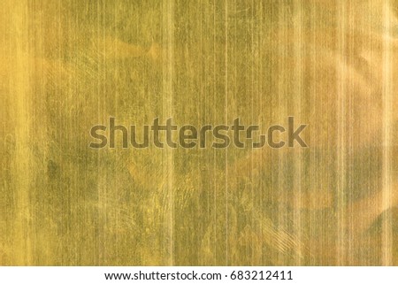 Shiny yellow gold foil texture for background.
