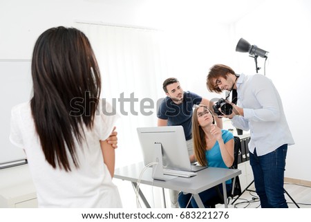 group of four photographer student learning creative portrait during photo shooting in photography school studio