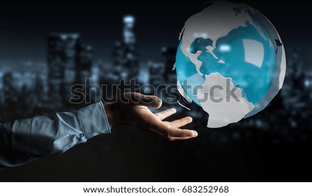 Businessman on blurred background using flying white and blue 3D rendering earth