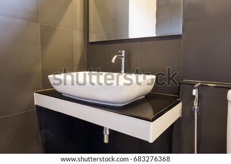 Clean and fresh bathroom with with basin natural light and decorated with retro style. Copy space background. modern interior