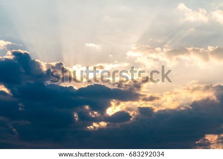Sunset with clouds, light rays and other atmospheric effect
