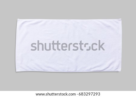 White beach towel mock up isolated with clipping path on grey background, flat lay top view Royalty-Free Stock Photo #683297293