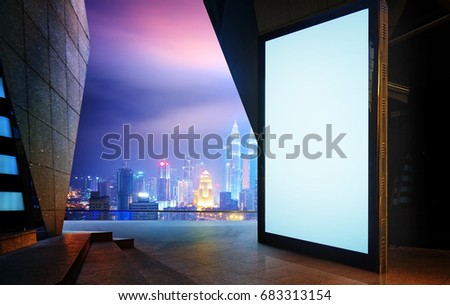 Big empty screen billboard with modern city background .