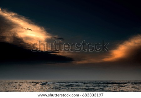 A terrible sky above the sea at sunrise or sunset