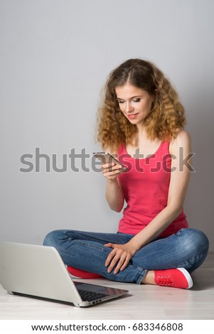 Young red-haired woman with laptop