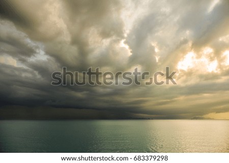 Darkness rain cloud cover the sea and storm come to island at the gulf of Thailand in the rainy season of Thailand.