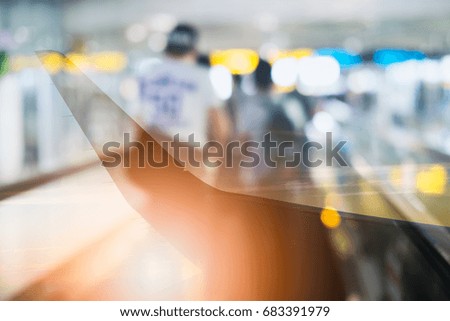 Double exposure of View on the sunset and airplane wing from the inside People walking in the airport, Airline passengers in the airport, passengers rushing at big city station.
