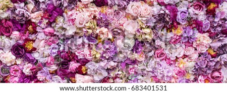 Flower texture background for wedding scene. Roses, peonies and hydrangeas, artificial flowers on the wall. Banner fow website.