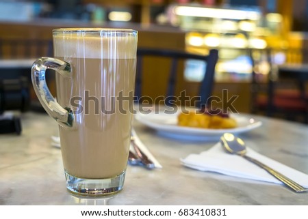 A glass of hot latte coffee.(With selective focus)