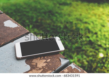 Smartphone on rusty floor
