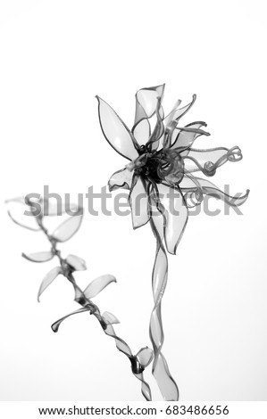 Plastic flower in black and white, recycled plastic
