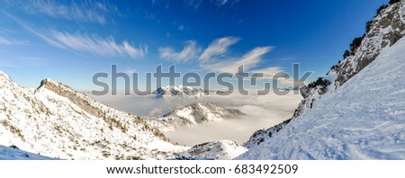 XXL panorama view of the Ester Mountains (Estergebirge) in the background with Krottenkopf (2086m) as highest point. Photo taken at a ski slope near Osterfelderkopf near Zugspitze and Garmisch. 