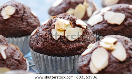 Chocolate banana cupcakes with almonds. The picture concepts are fat, unhealthy.