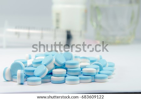 Medicine. Medicine color Blue-white. Blue-white tablets.