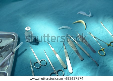 Surgical instruments, silicone nasal implant in operating room.