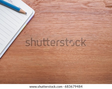 Wood with notebook and stationery as a copy space background