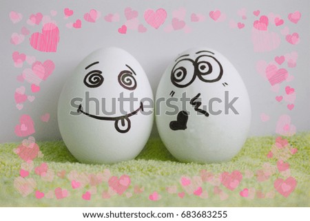 Eggs are cheerful with a face. Two pieces. Concept of love without an answer to show the language. Photo for your design Frame of hearts. love