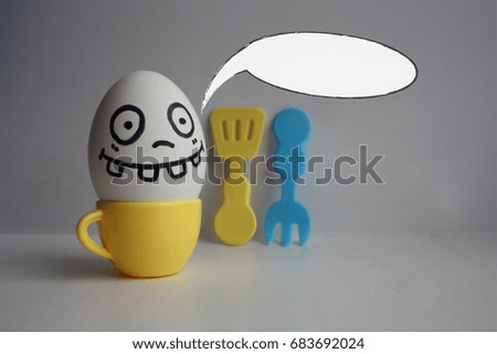Eggs with face. Concept of a freak in the kitchen. Photo for your design. The cloud of thought is white. Place under the text.