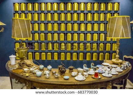 Concept of gold tea box and cup and teapot