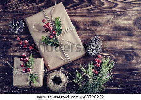 Christmas background with hand crafted gifts, presents on rustic wooden table