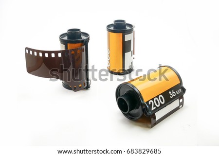 Photo film in cartridge isolated, Photographic roll film 35 mm on a white background.
