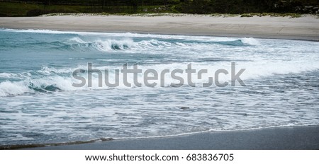 Big surfing ocean sea waves on sandy beach. Background landscape picture strong waves of Atlantic ocean in Spain. Ready for surfing.