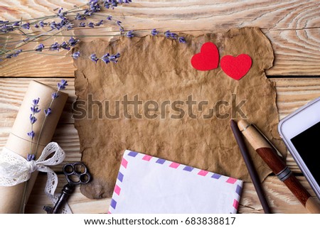 Old paper with lavender and gift on the wooden table background. Vintage concept
