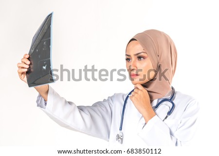 Hijab medical doctor looking at x-ray picture