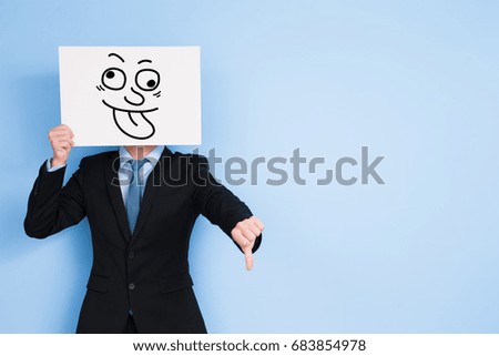 businessman take funny billboard and show bad to you on blue background