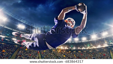 American football player jumps with a ball on a professional sports arena with bleaches full of people. Arena and people on it are made in 3D.