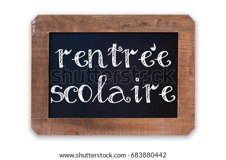 Rentree scolaire (meaning Back to school) written on a vintage blackboard with wooden frame isolated on white background