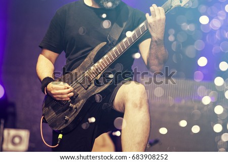 Guitarist on stage, night entertainment, music festival