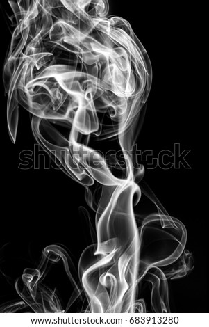 Movement of smoke,white smoke on black background.
