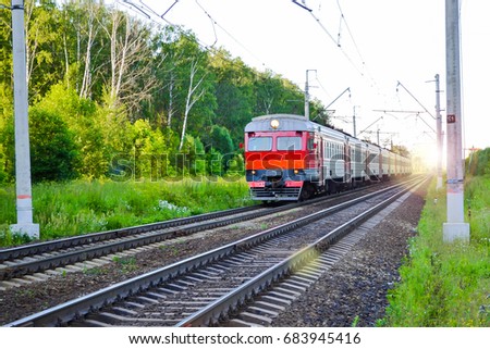 Passenger commuter train in motion. Russia Royalty-Free Stock Photo #683945416