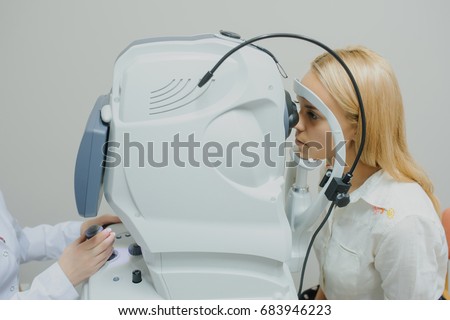 close up head of young patient fix in Tomography in Optical Coherence (OCT) equipment. Royalty-Free Stock Photo #683946223
