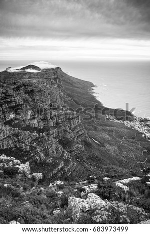 Scenic view of Twelve Apostles and coastline from Table Mountain in Cape Town, South Africa in black and white