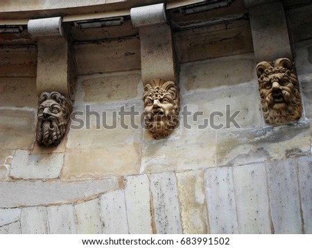 Sculptured heads decorating "Pont Neuf" bridge in Paris, France Royalty-Free Stock Photo #683991502