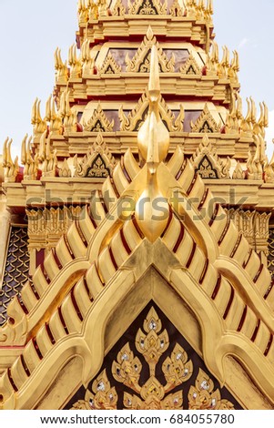 Close up on detail architecture of thai temple, abstract golden texture.