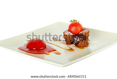 Picture of strawberry lava cake on a white plate - isolated background