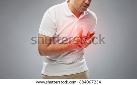 people, healthcare and problem concept - close up of man suffering from heart ache over gray background Royalty-Free Stock Photo #684067234