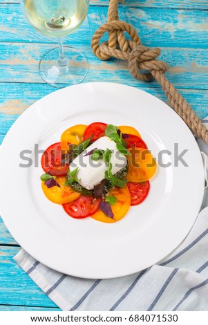 Colourful slices of cheese and tomato