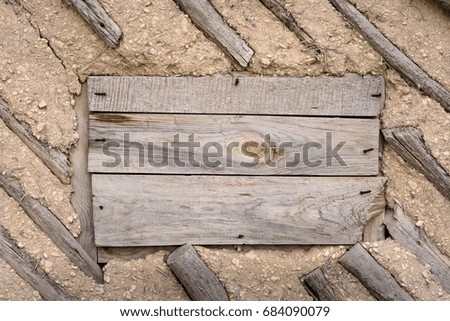 Wall of natural wood and clay. Old boards background. Ancient architecture, handmade. Rustic style.
