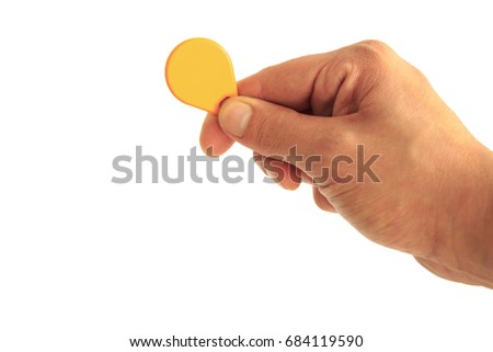 Key from the intercom in the right hand on white background , isolated
