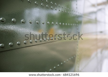 Close up vintage military aircraft metal texture. Aluminum metal texture with rivets.