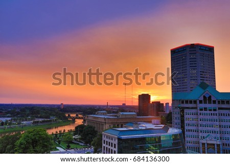 The Scioto River glows orange during sunset in Columbus, Ohio