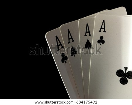 Blur picture of Playing Cards- Four Aces isolated on black background