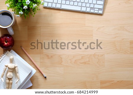 Office desktop with office accessories, Wood table with business objects and snack foods. Copy space for text or products display montage.
