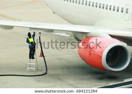 Refueling of the aircraft at the airport Royalty-Free Stock Photo #684221284