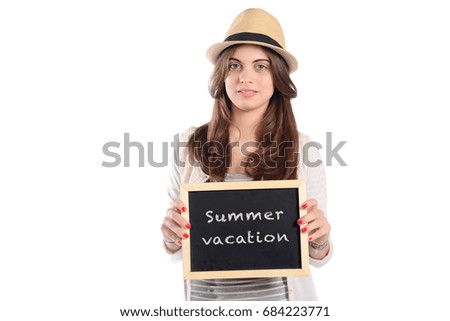 Portrait of latin woman holding chalkboard with text "Summer vacation". Travel concept. Isolated white background.