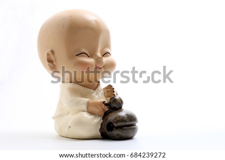 chinese ceramic young monk doll isolate on white background with copy space.